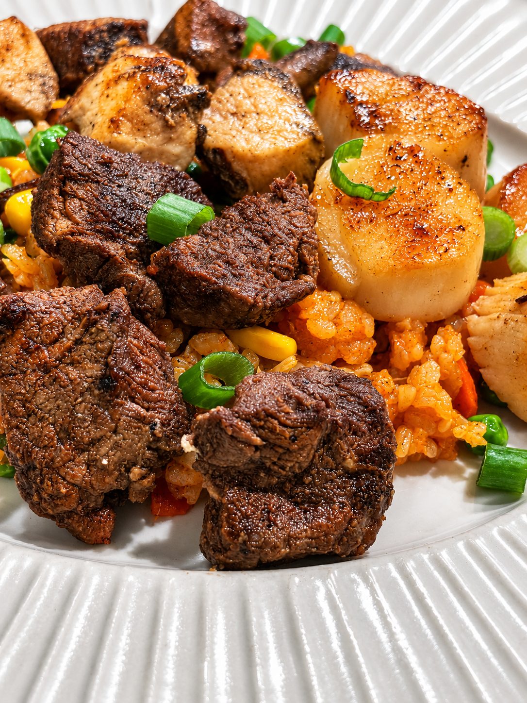 Plated hibachi surf and turf with kimchi fried rice